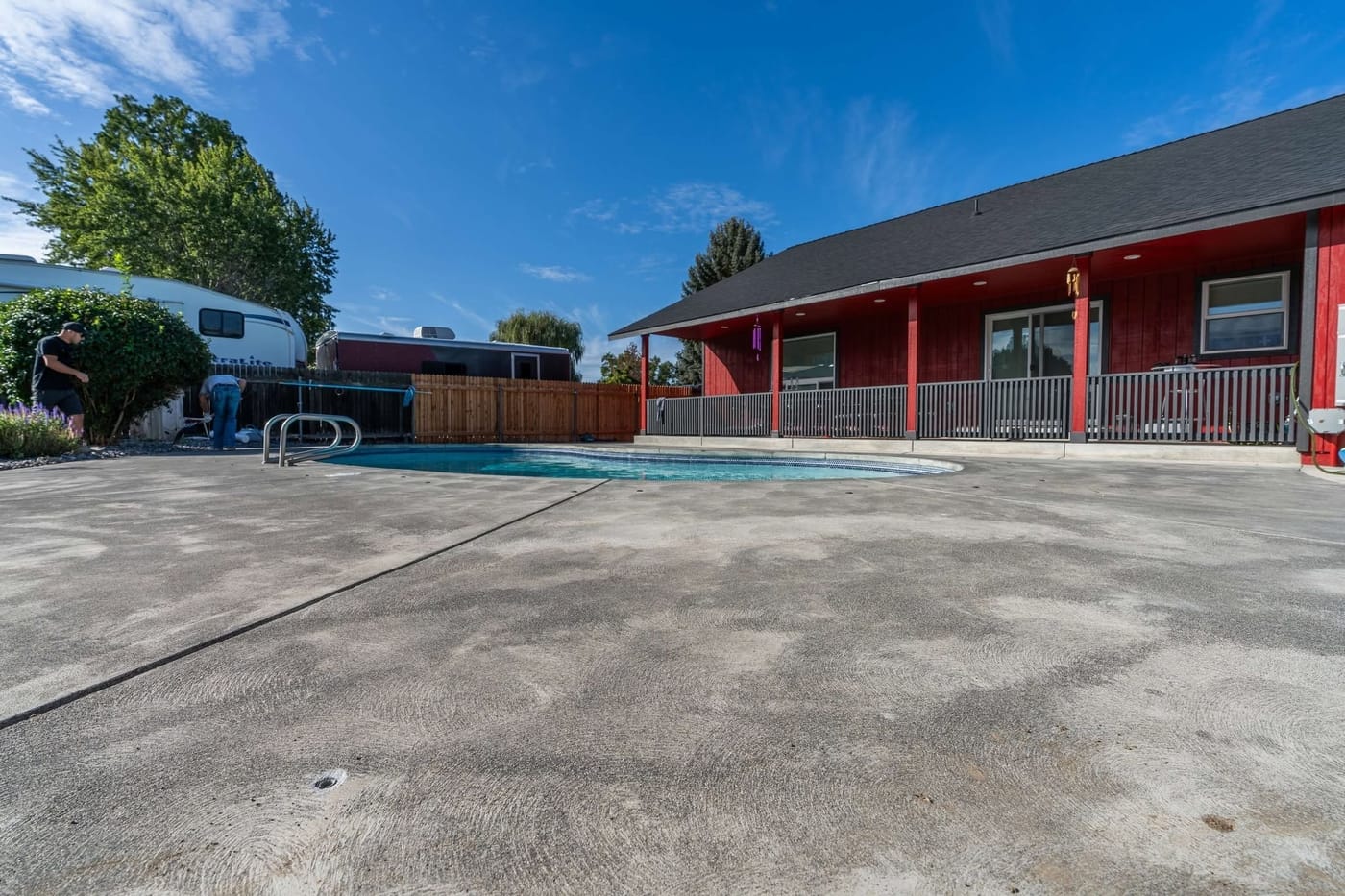 Pool deck concrete before outdoor coating work.