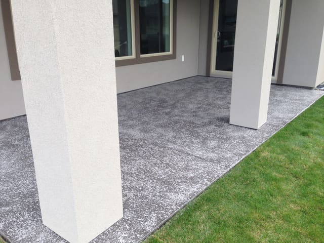 Covered patio concrete surface finished with a decorative outdoor coating.