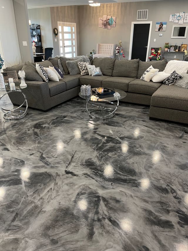 Living room floor finished with a glossy gray marbled epoxy coating.