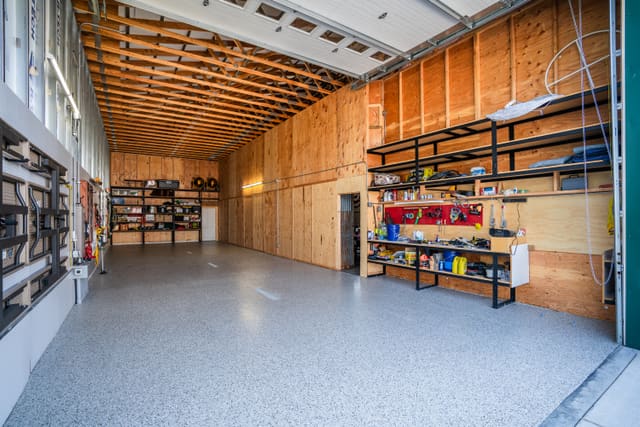Finished garage floor with a gray decorative flake coating.