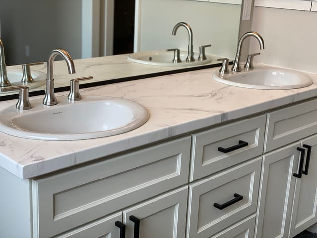 Double bathroom vanity countertop with a light epoxy coating.