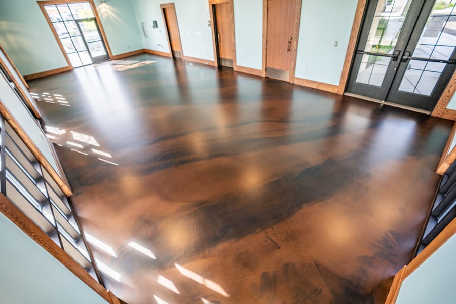 Glossy decorative indoor concrete coating with warm brown tones.