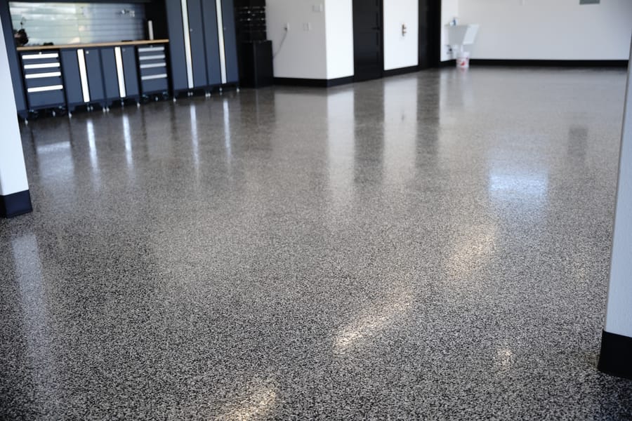 Finished garage floor with a gray decorative flake coating.